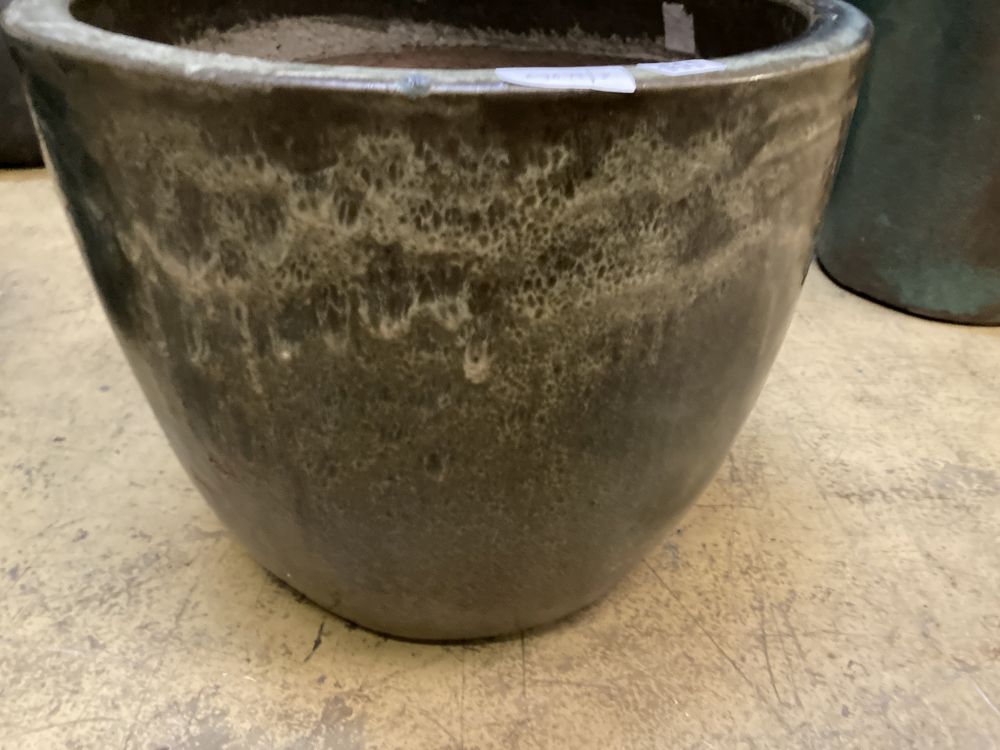 A circular green glazed garden planter, width 48cm, height 39cm